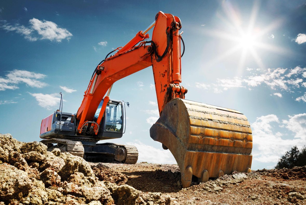 Bagger auf Baustelle Zu sehen ist ein dunkelorangener Bagger bei der Arbeit
