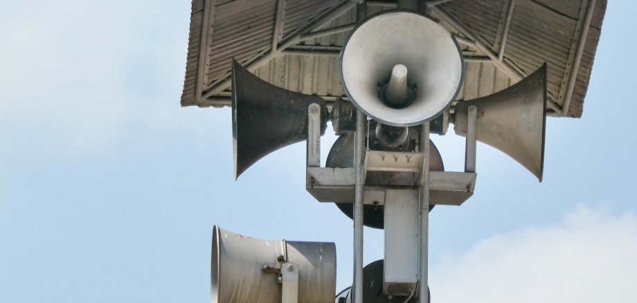 Vintage horn speaker tower with loudspeaker against the sky. System of alert for population. Vintage horn speaker tower with loudspeaker against the sky. System of alert for population.