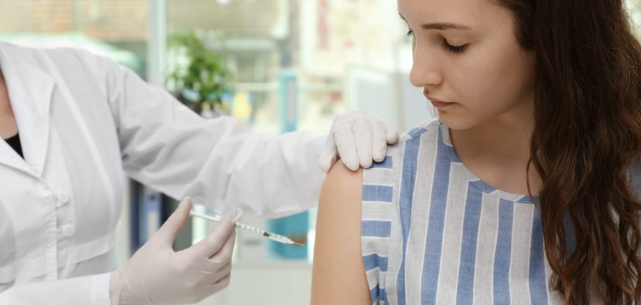 Young girl receiving vaccination in hospital