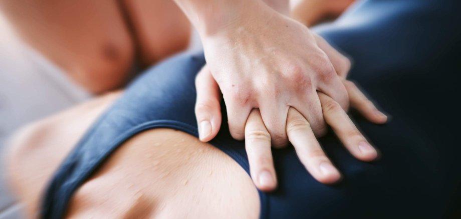 Hands, cpr and chest compression for swimming emergency, drown or accident with lifeguard. Sports, breathing and resuscitation of woman, rescue of athlete or saving life of swimmer in top view.