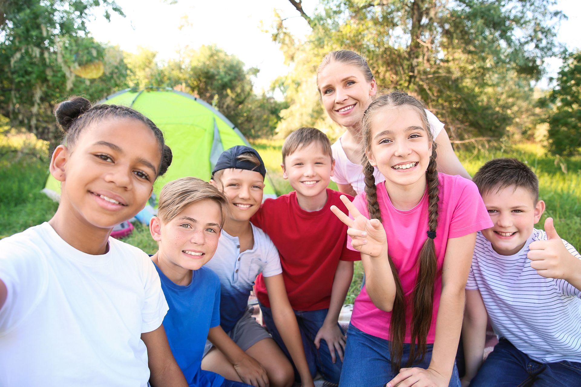 Group of children taking selfie at summer camp