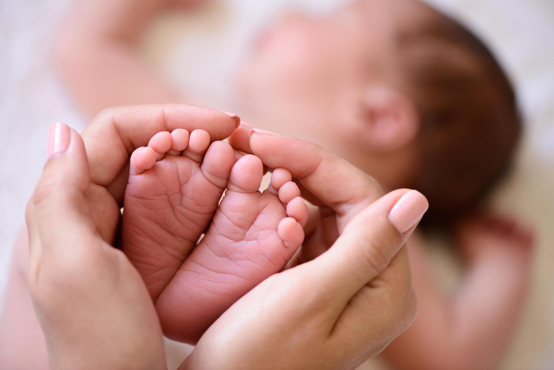 tiny foot of newborn baby