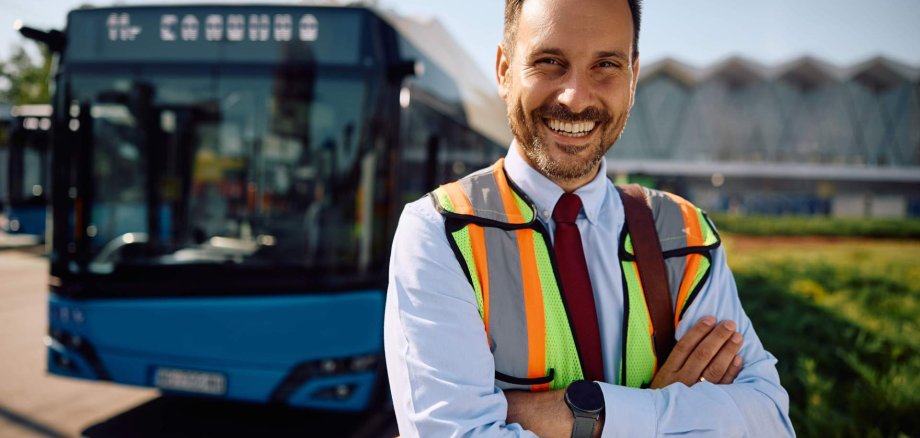 Happy driver at bus station looking at camera. Happy driver at bus station looking at camera.