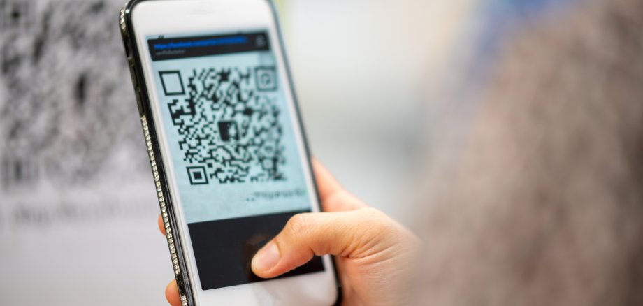 women using a mobile phone to scan a pr code for payment women using a mobile phone to scan a pr code for payment