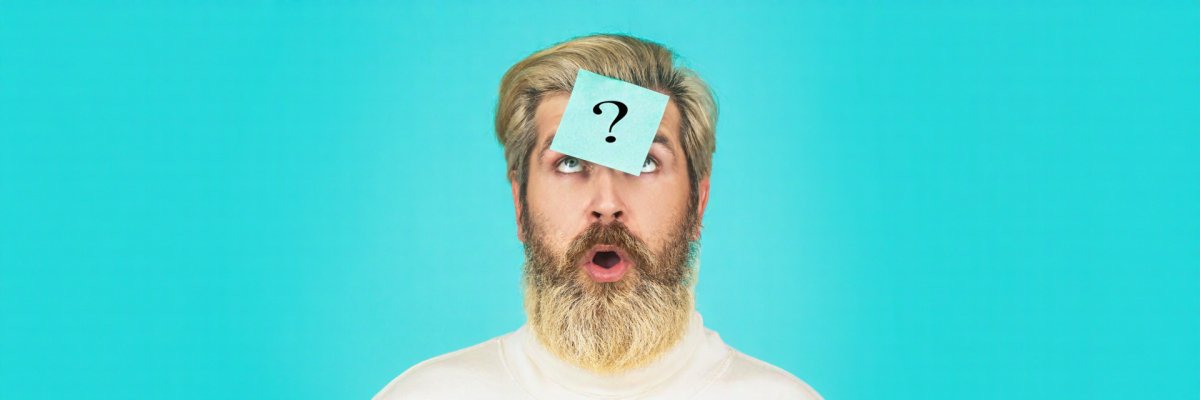 Man with question mark on forehead looking up. Paper notes with question marks. Beard man question mark in head, solution problems