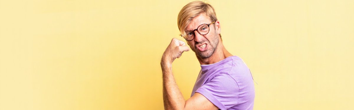 feeling happy, satisfied and powerful, flexing fit and muscular biceps, looking strong after the gym