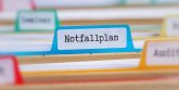 Akten mit der Beschriftung Notfallplan Akten mit der Beschriftung Notfallplan